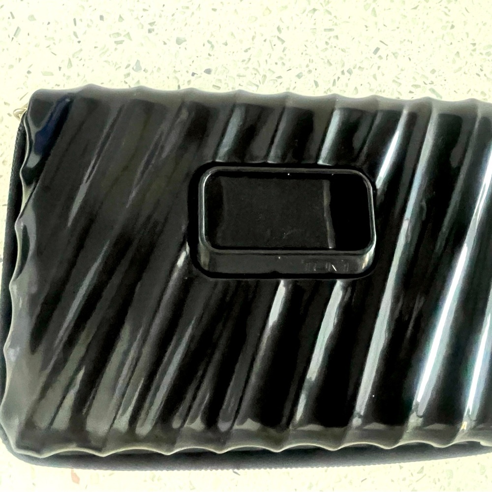 TUMI brand cosmetic case- zipper hardcover! never used